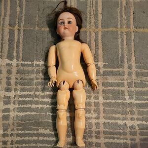 Antique Porcelain Doll with Blue Eyes and Brown Hair